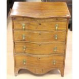 A Georgian style serpentine fronted mahogany chest of drawers, comprising brushing slide over four