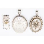 A Victorian silver locket, by Adie & Lovekin, Birmingham, 1882 another Victorian oval brooch and a