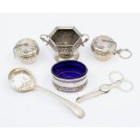 A group of table silver to include: a pair of tea infusers; a Georgian style salt; a Victorian