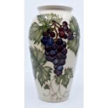 Moorcroft Pottery: A Moorcroft Collectors Club 'Grapevine' pattern vase designed by Sally Tuffin.