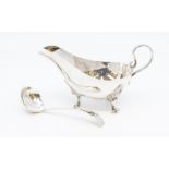 A George VI silver sauceboat, plain with acanthus and scroll feet, by James Dixon & Sons, Sheffield,