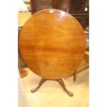 A 19th Century and later tilt top tripod table, fitted with an oval top, raised on a two part turned