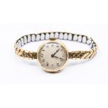A 1920's 9ct gold watch, machine engraved champagne dial, black number markers, dial approx 20mm,