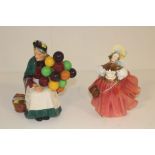 Two Royal Doulton figures, comprising 'The Old Balloon Seller' HN1315, and 'The Skater' HN2117 (2)
