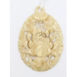 A small Chinese jade carved pendant, in an ivory colour