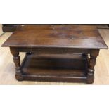 A traditional joined oak coffee table, in the 17th Century manner, having turned supports and a