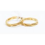 A pair of 18ct gold wedding bands, textured entwined details, sizes O, combined gross weight