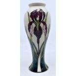 Moorcroft Pottery: A Moorcroft Collectors Club 'Purple Iris' pattern vase designed by Nicola Slaney.