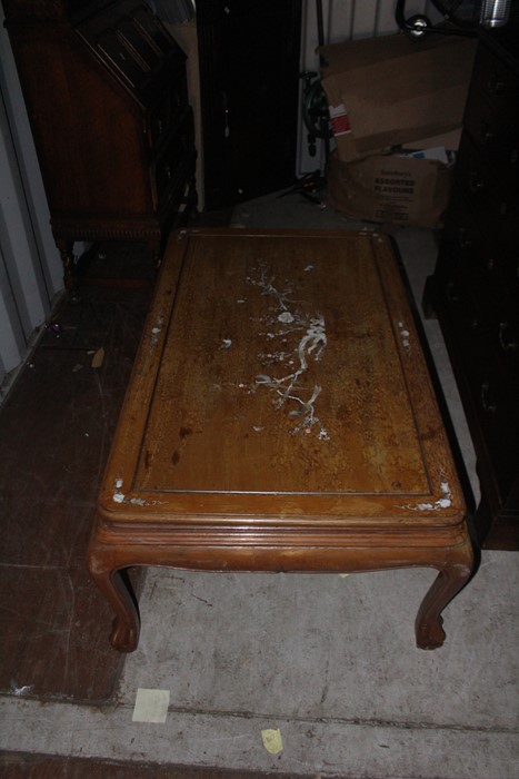 A large Chinese hardwood coffee table, inlaid to top with mother-of-pearl, measuring 50cm high,