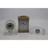 Three various clocks, comprising a Waterford cut glass mantle clock, a further cut glass mantle