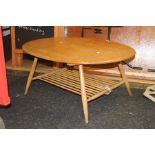 An Ercol style light elm and beech coffee table AF