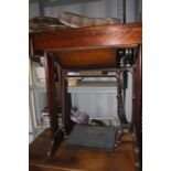 An early 20th Century Singer tredle sewing machine, mahogany casing, 74cm high, 79cm wide, 43cm