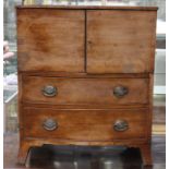 An early to mid 19th Century mahogany pot cupboard, comprising two doors over two drawers, raised on