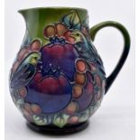 Moorcroft Pottery: A Moorcroft 'Finches' pattern jug. Height approx 14.5cm. Impressed Moorcroft,