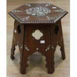 An early 20th century, Liberty-style hardwood and ivory inlaid hexagonal fold up card table, in