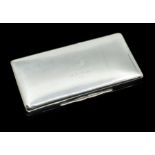 A George V silver rectangular cigarette box and cover, plain body the cover engraved with crest