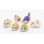 Six small Royal Crown Derby paperweights with gold stoppers, including a wren, two hedgehogs, pig,