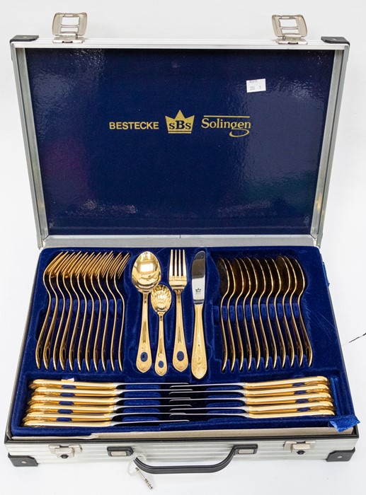 An aluminium cased, ten-piece, gold-plated Bestecke Solingen canteen of cutlery, made in Germany ***