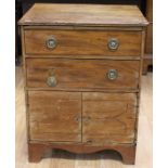 A George III mahogany pot cupboard, comprising two doors over two drawers, plinth base, 76cm high,