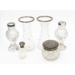 A collection of silver topped glass vases, two pairs, powder pot, perfume bottle, all silver