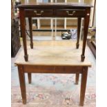A late 19th Century joined pine topped kitchen table, raised on square legs, together with an