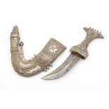 A 19th Century Arabian Janbiya shortsword and white metal scabbard, Yemen, the hilt and sheath (
