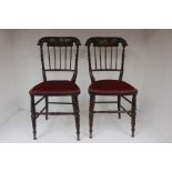 A pair of late Victorian bedroom chairs, the backs with elaborately turned spindles (2)