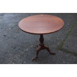 A George III mahogany tilt top tripod table, having a bird cage mechanism, 73cm high, 79cm in