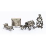 A collection of novelty silver to include: a German 800 standard model of a horse drawing a beer