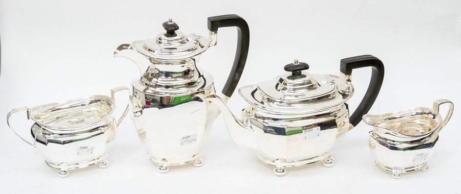 A George V silver matched four piece tea service comprising teapot, sugar bowl, milk jug and hot