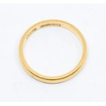 A 22ct gold wedding band, approx 2mm wide, size N1/2, weight approx 3gms  Condition report: Good-