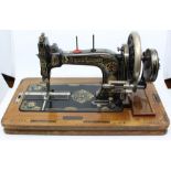 A Frister & Rossmann, circa 1910 sewing machine, hand powered, fitted in original case