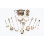 A collection of silver table ware to include: mustard pot cover; napkin rings and urn shaped