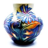 Moorcroft Pottery: A Moorcroft 'Chicory' pattern vase designed by Philip Gibson. Height approx 8.