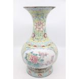 A Chinese famille vert enamelled baluster vase with yellow detail, 30 cm high