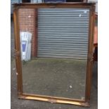 A gilt framed mirror, fitted with bevelled edge glass, 136cm high, 104cm wide