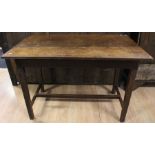 A 19th Century joined oak kitchen table, having a three plank top, raised on square supports, 72cm