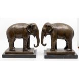 A pair of bronze Elephants, each on marble plinths, 20th Century  Provenance: from the Estate of the