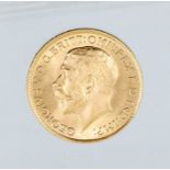 A 1915 George V gold sovereign, London mint.