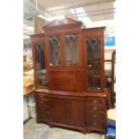 A Chippendale style mahogany display cabinet, the upper section with a broken shaped pediment,