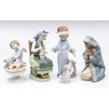 A collection of five Lladro figures, all boxed