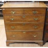 A George III oak chest of drawers, comprising two short over three long graduated drawers, all