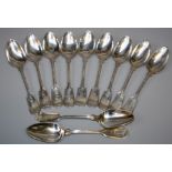 A set of twelve white metal fiddle and thread table spoons, monogrammed LSB. 20 troy oz.