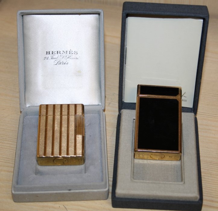 A gold plated Dupont cigarette lighter in fitted Hermes box, numbered AHC599, together with a Dupont