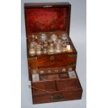 An early Victorian brass bound mahogany apothecary box with the bottle filled and fitted interior