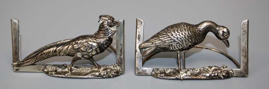 G and Co, a pair of Edwardian silver menu holders, one cast with a cock pheasant, the other a Goose.