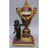 A 19th century, Louis XVI style porphry and ormolu eight day cercle tournant mantel clock in the