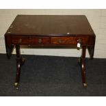 A Geo III figured mahogany sofa table fitted two frieze drawers. Raised on stile ends with, brass