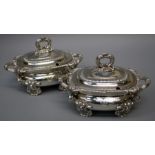 A pair of important Regency silver sauce tureens and covers, each with shell feet and reeded