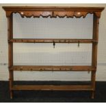 A 19th century pine delft rack, the moulded cornice over shaped frieze and three open shelves. 109 x